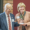 Jim Sugihara receives his Distinguished Alumnus Award from Cindy Burrows