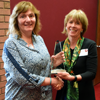Diane Parry receives her award from Cindy Burrows