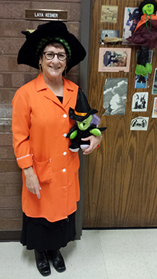 Laya Kesner in her witch costume and orange lab coat