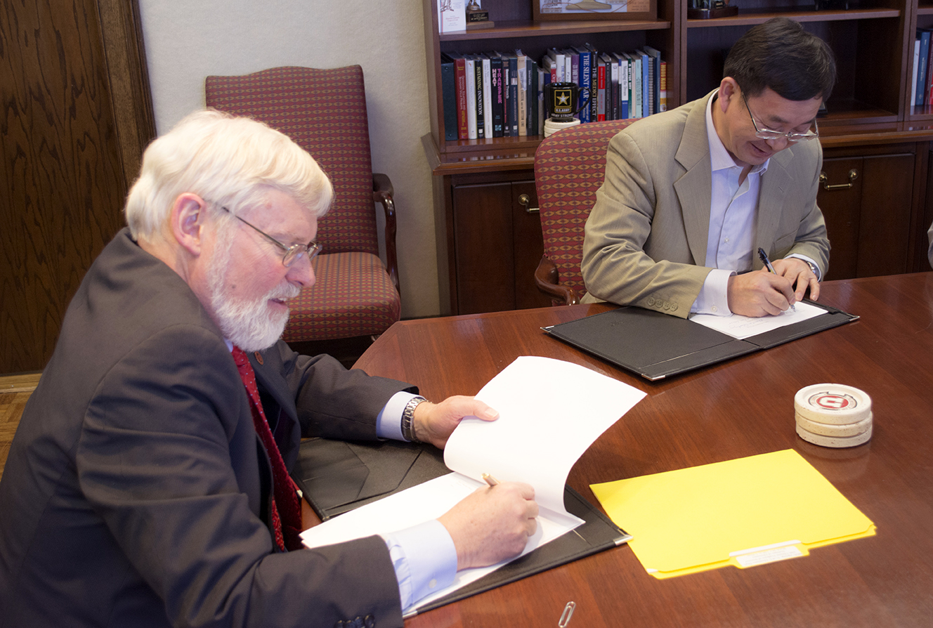 President Pershing and Prof. Zhang Deging sign the collaboration agreement